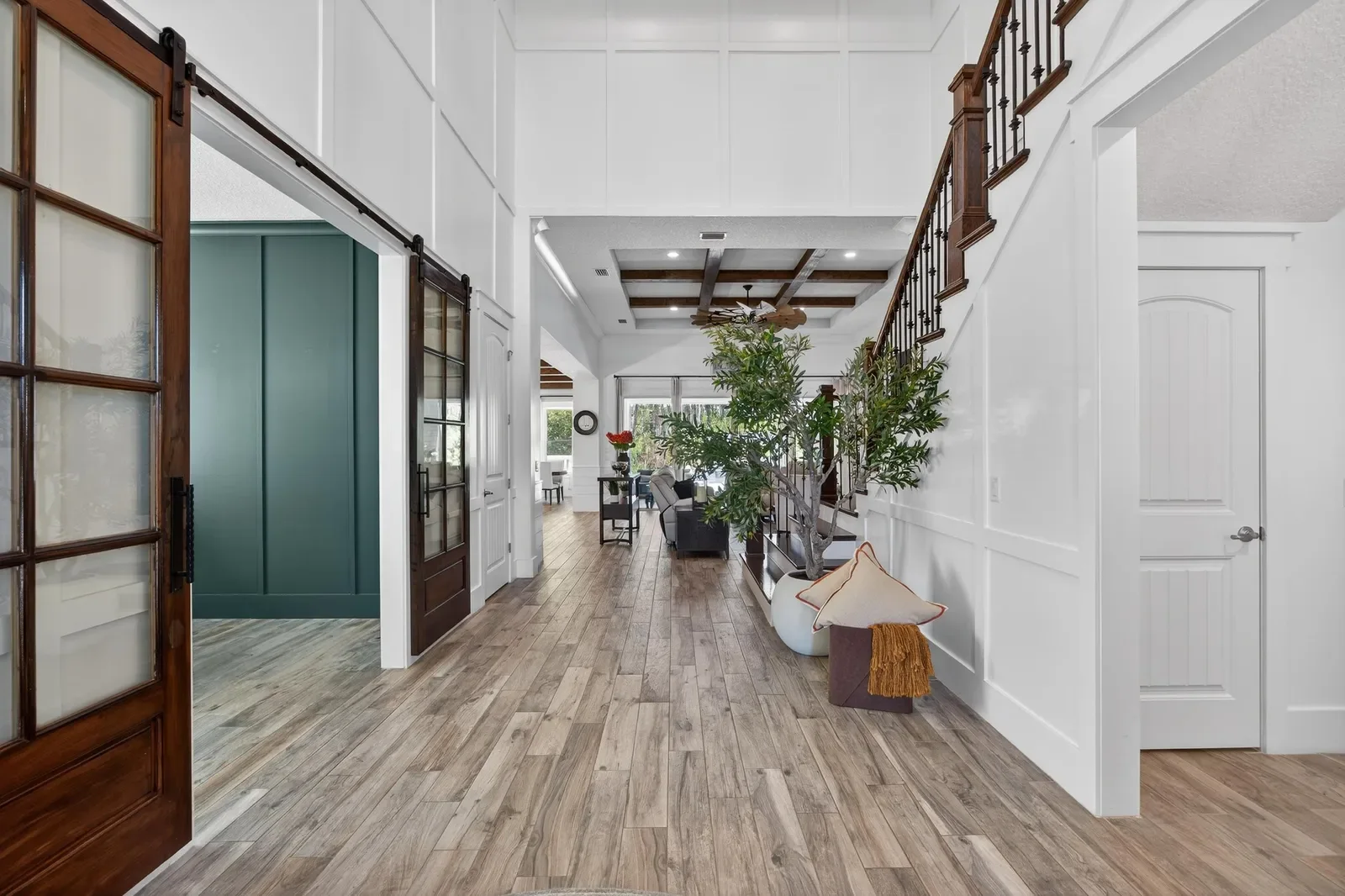 Bright living room with shiplap and modern fireplace in St. Johns, FL. Real estate photography by Megapixeler
