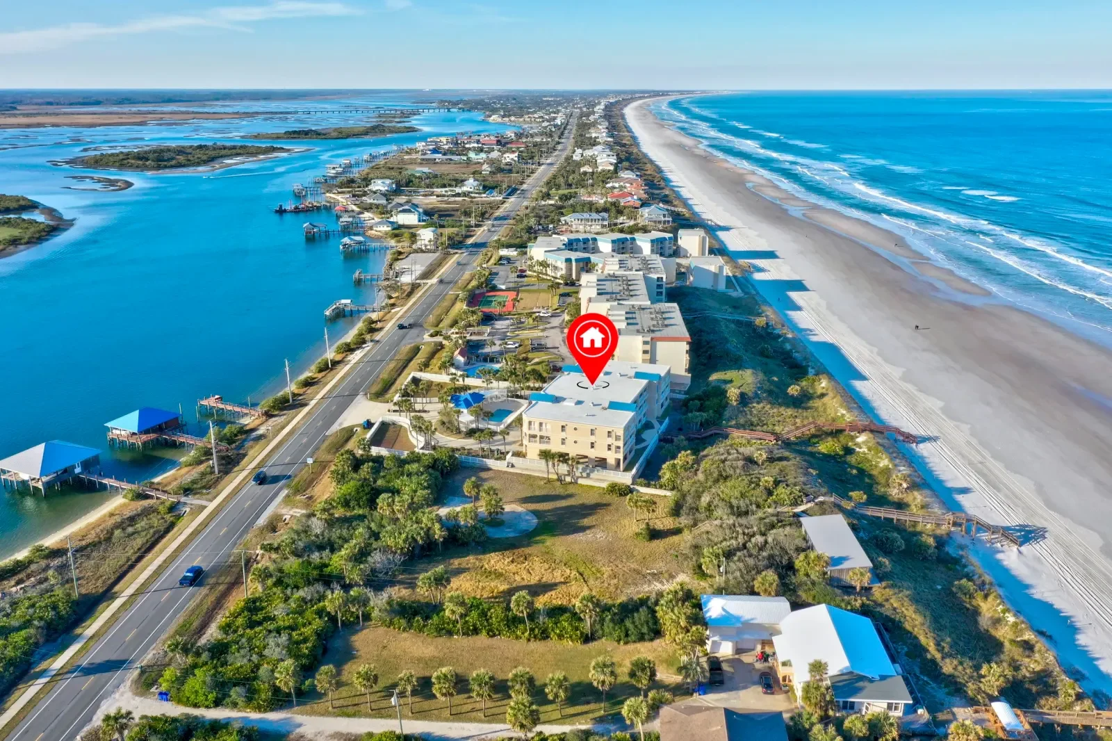 Drone photo with location pin on an oceanfront building along the Atlantic beach in North Florida. Drone photography by Megapixeler
