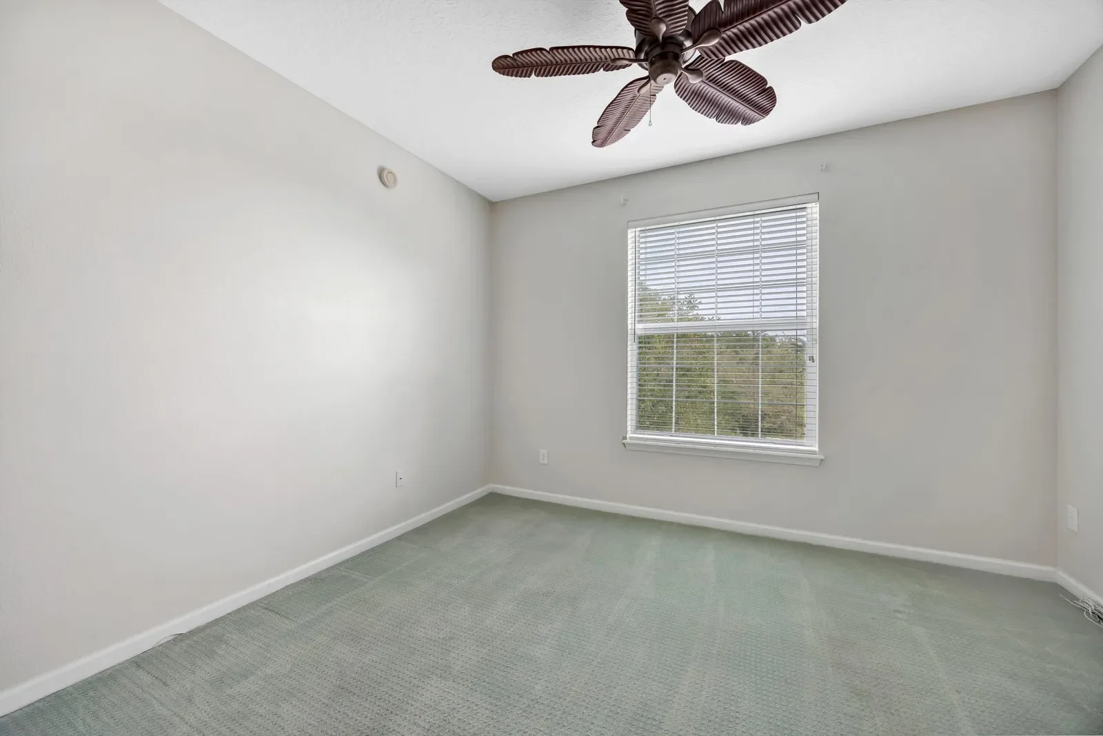 Empty bedroom before virtual staging as an office in North Florida. Real estate photography by Megapixeler