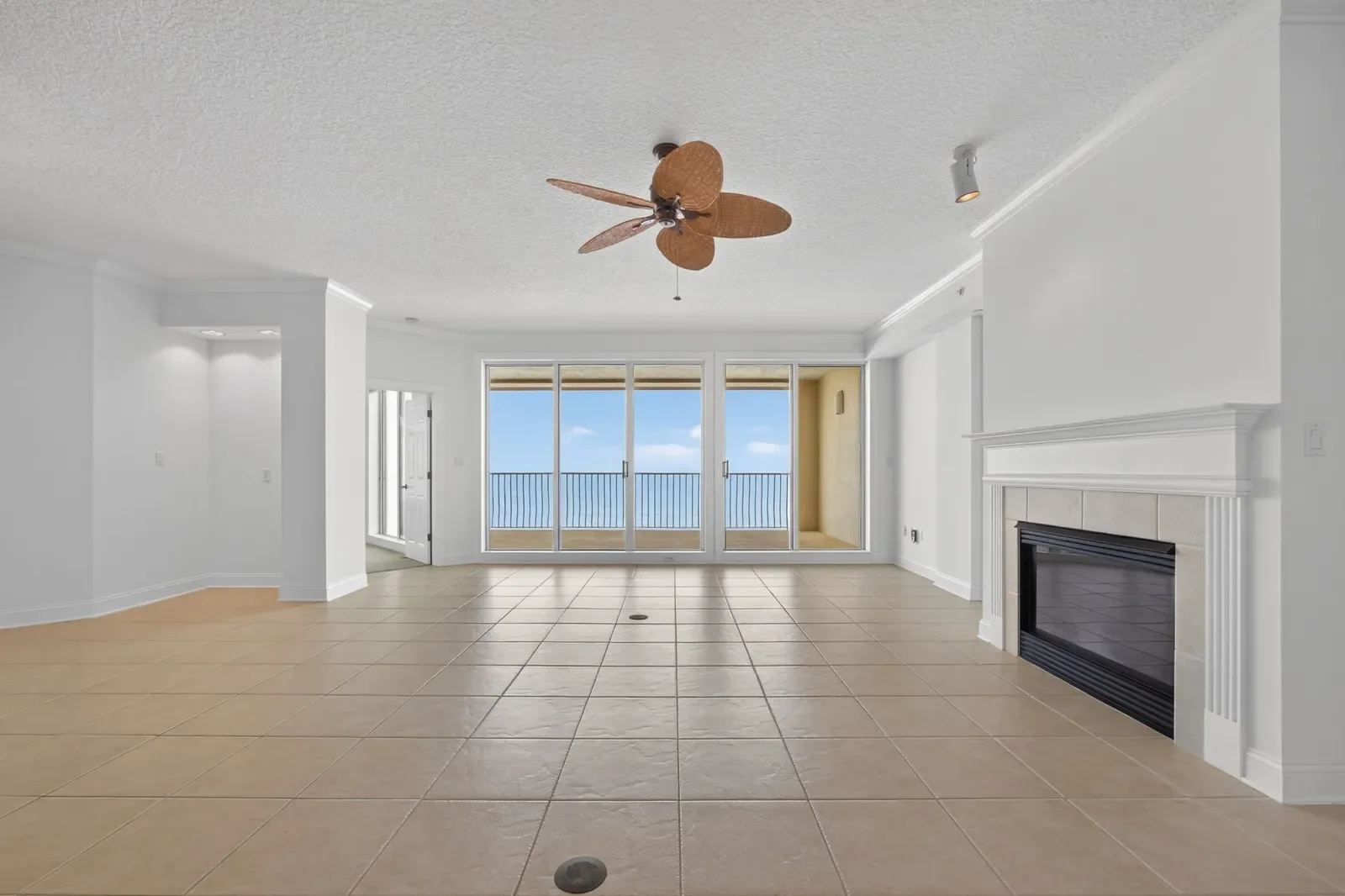 Empty oceanfront condo living room before virtual staging in North Florida. Virtual staging by Megapixeler