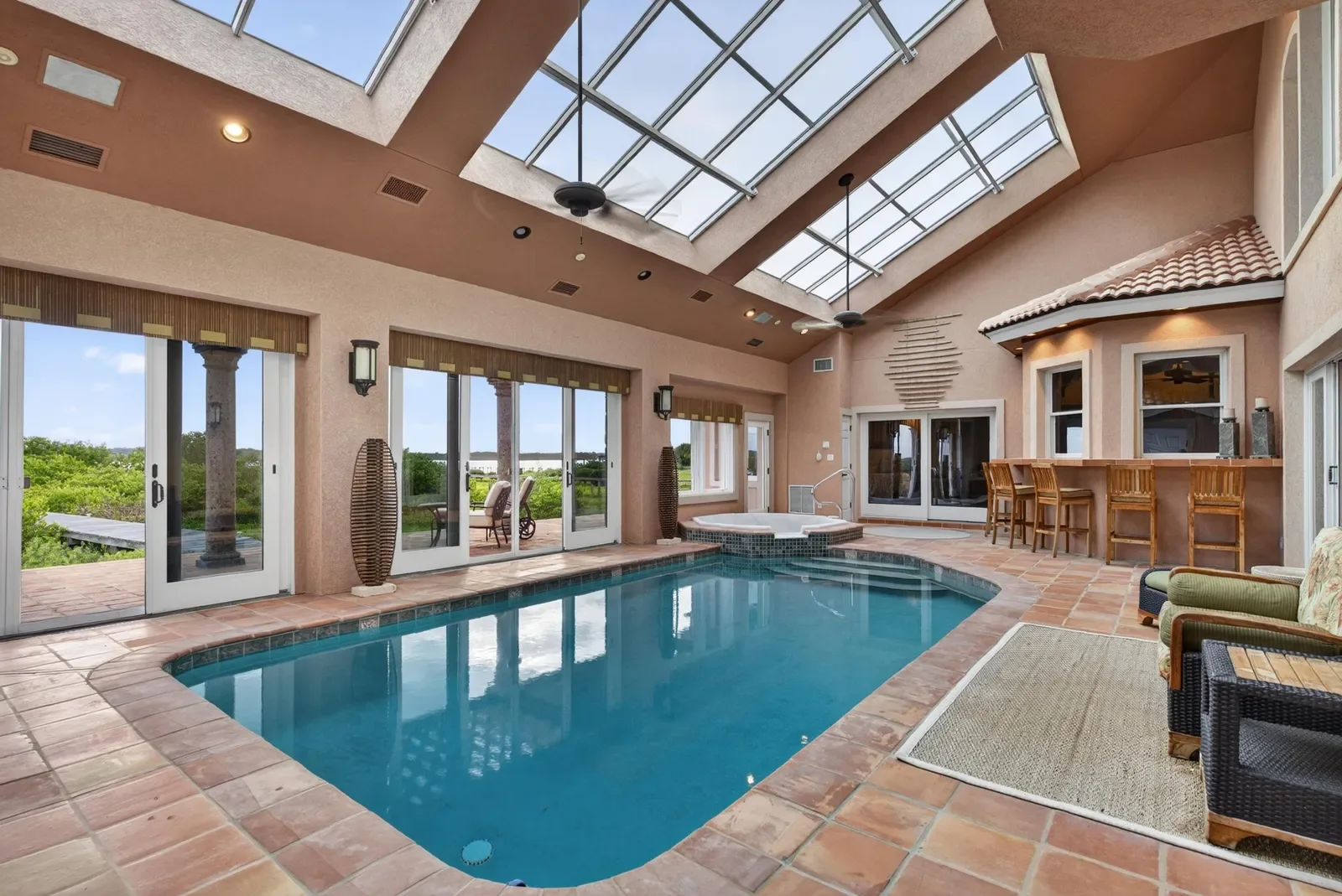 Indoor pool under a skylight roof in St. Augustine, FL. Real estate photography by Megapixeler
