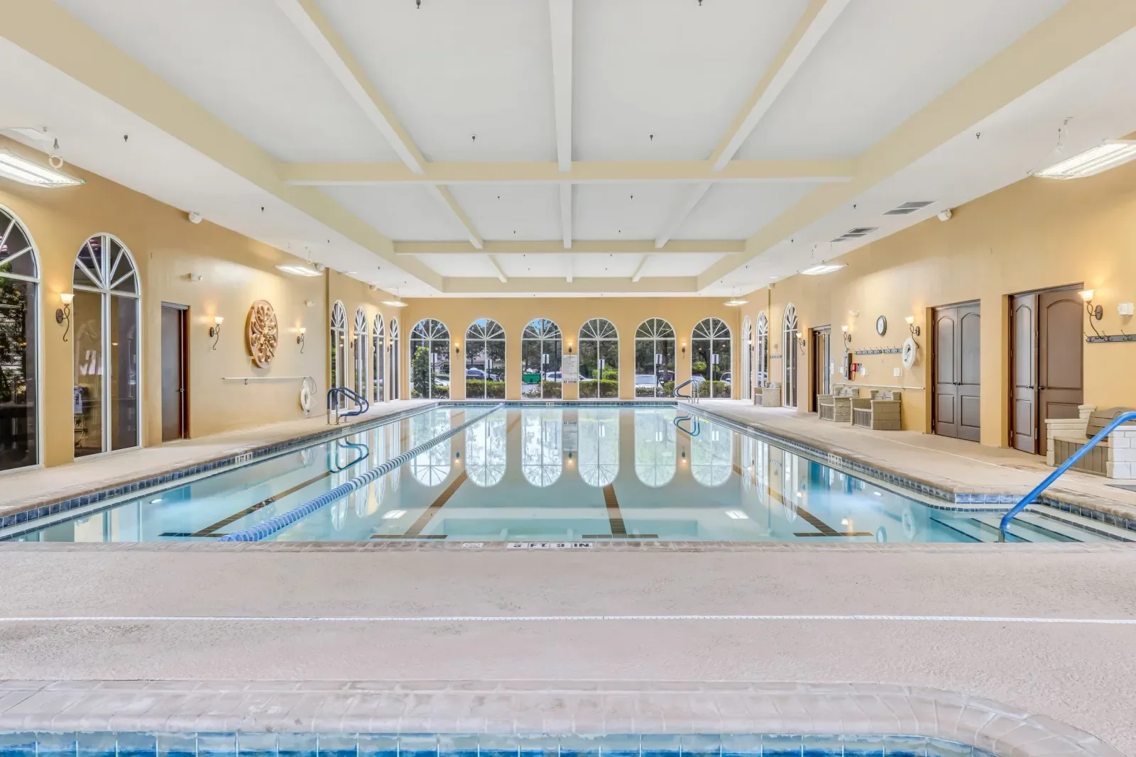 Indoor resort pool under a coffered ceiling, Sweetwater by Del Webb in Jacksonville, FL. Real estate photography by Megapixeler