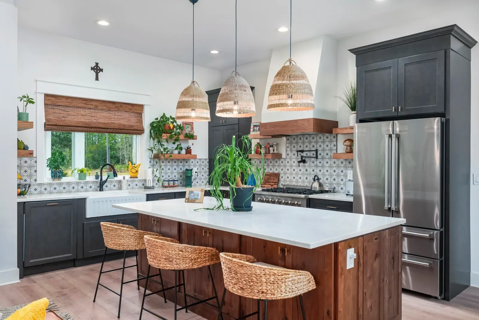 Kitchen with rattan pendants and walnut island in North Florida. Real estate photography by Megapixeler
