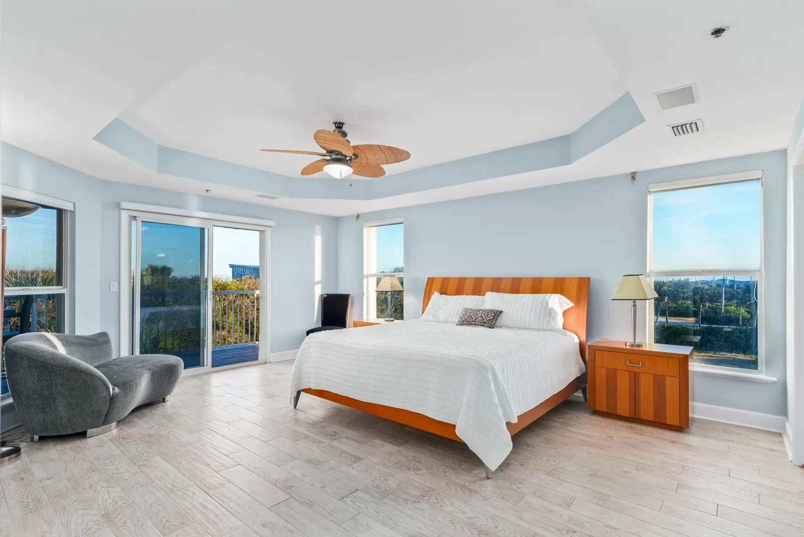 Primary bedroom with water views in North Florida. Real estate photography by Megapixeler