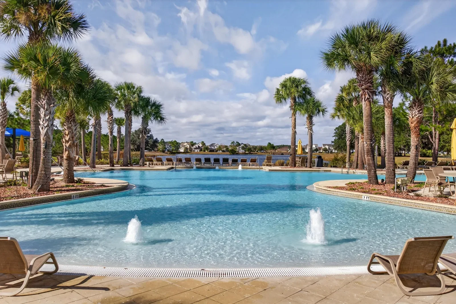 Resort-style community pool with fountains in North Florida. Community amenity photography by Megapixeler