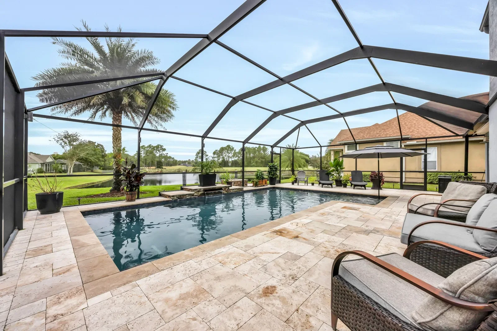 Screened pool on the golf course in St. Johns, FL. Real estate photography by Megapixeler