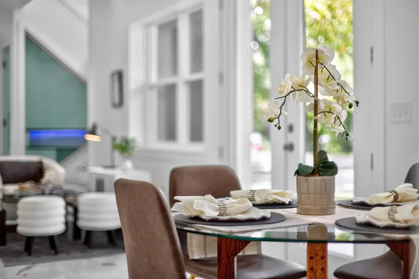 Set dining table with orchids in North Florida. Real estate photography by Megapixeler