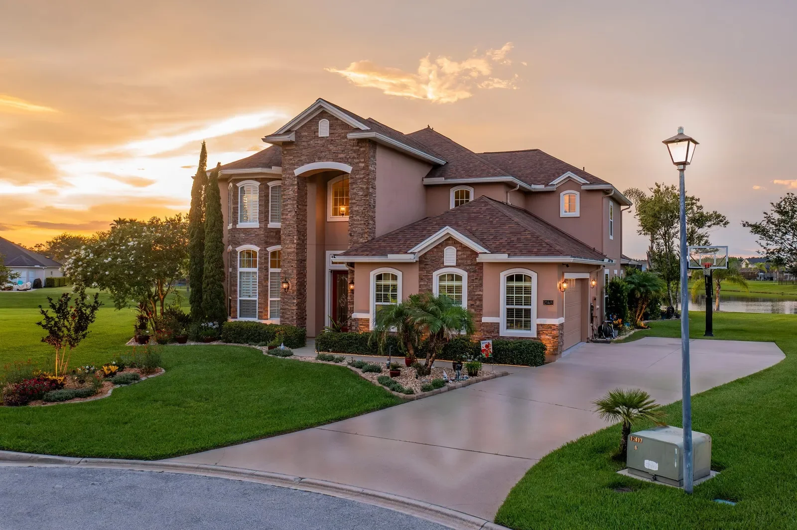 Twilight photo of a brick two-story home in St. Augustine, FL. Twilight photography by Megapixeler