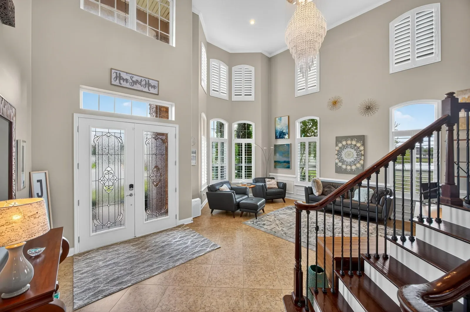 Two-story great room with walls of windows in St. Augustine, FL. Real estate photography by Megapixeler