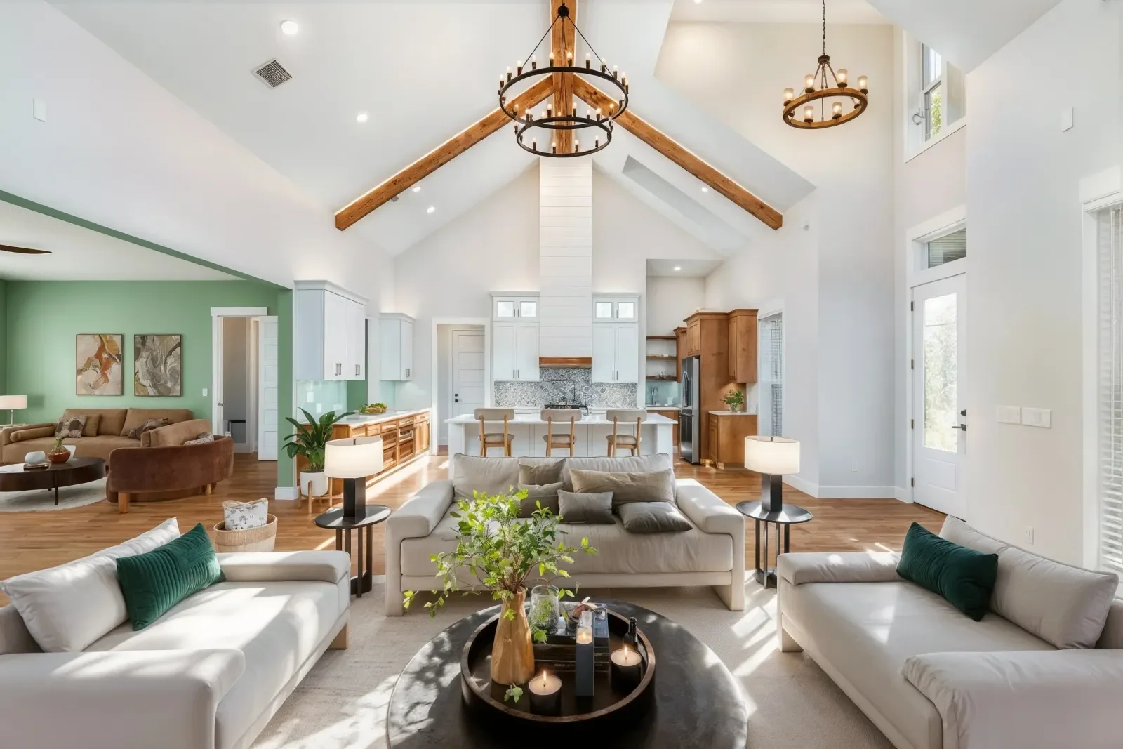 Vaulted great room after virtual staging with sectional sofas and coffee table in North Florida. Real estate photography by Megapixeler